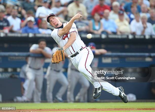 Chipper Jones of the Atlanta Braves to first base for the out against the Chicago Cubs at Turner Field on August 14, 2008 in Atlanta, Georgia.