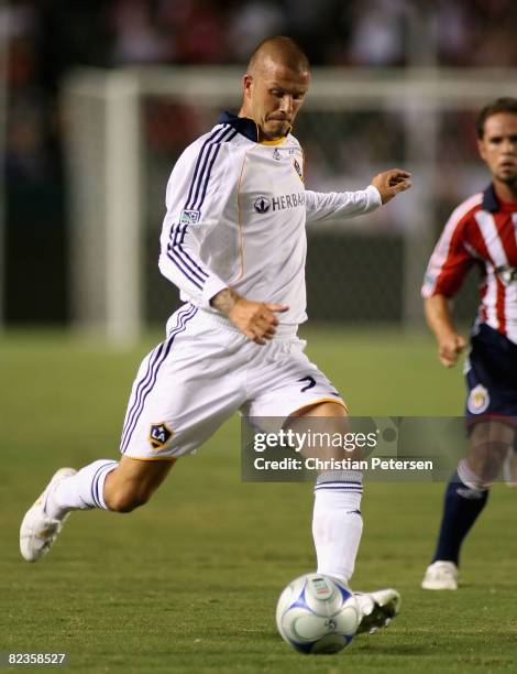 David Beckham of the Los Angeles Galaxy passes the ball during the game against Chivas USA at Home Depot Center on August 14, 2008 in Carson,...