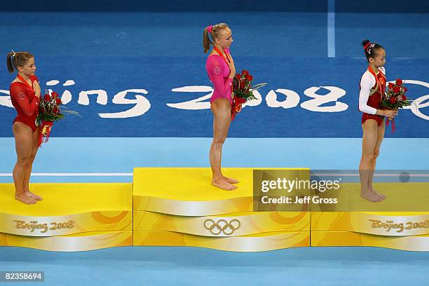 Silver medalist Shawn Johnson of the United States, gold medalist Nastia Liukin of the United States and bronze medalist Yang Yillin of China pose...