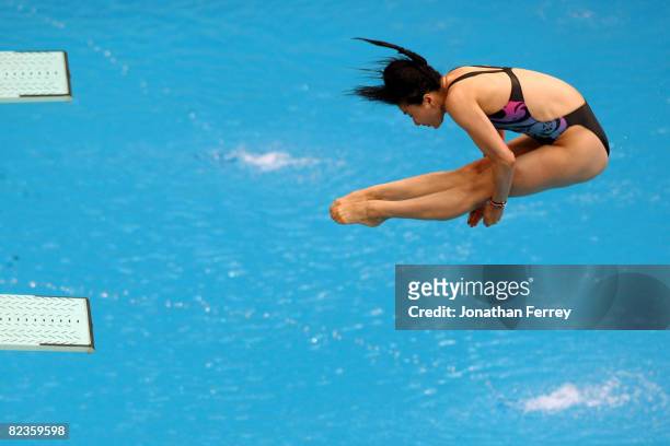 Guo Jingjing of China dives in the Women's 3m Springboard Preliminary held at the National Aquatics Centre during Day 7 of the Beijing 2008 Olympic...