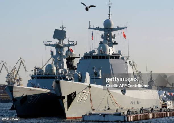 Photo taken on July 27, 2017 shows Chinese Type 052D missile destroyer Hefei and Chinese Type 054A frigate Yuncheng docked in Saint Petersburg....