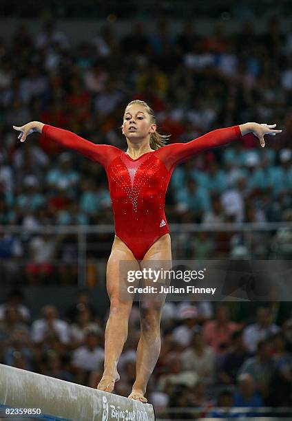Shawn Jonhson of the United States competes on the balance beam in the artistic gymnastics event at the National Indoor Stadium on Day 7 of the...