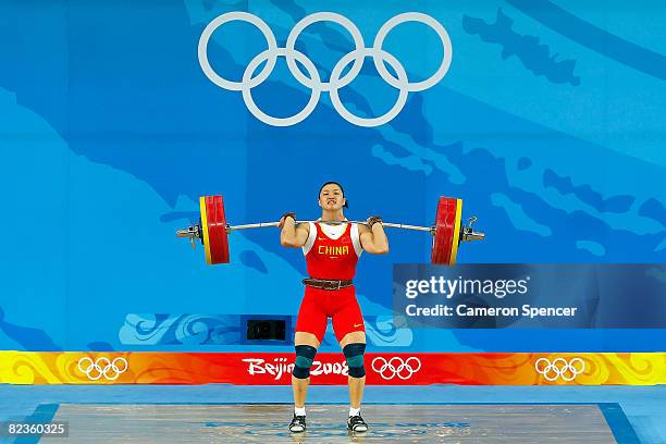 Cao Lei of China competes in the women's 75kg weightlifting event at the Beijing University of Aeronautics & Astronautics Gymnasium on Day 7 of the...