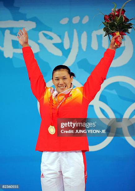 Gold medalist Cao Lei of China poses during the medal ceremony for the women's 75 kg weightlifting event during the 2008 Beijing Olympic Games on...