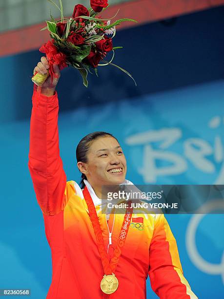 Gold medalist Cao Lei of China poses during the medal ceremony for the women's 75 kg weightlifting event during the 2008 Beijing Olympic Games on...