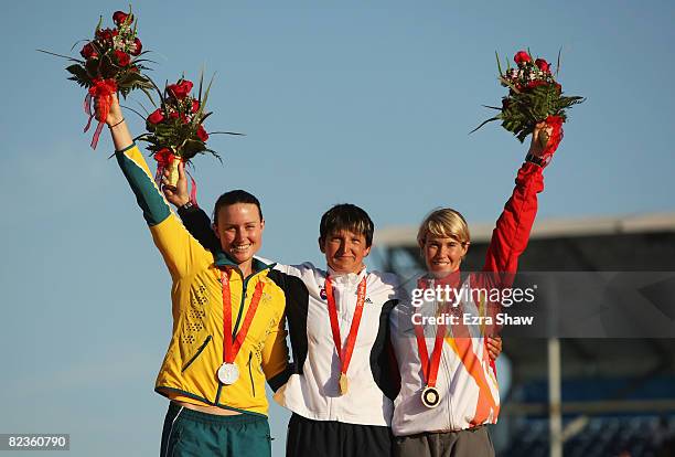 Silver medalist Jacqueline Lawrence of Australia, gold medalist Elena Kaliska of Slovakia and bronze medalist Violetta Oblinger Peters of Austria...