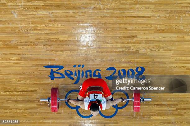 Cao Lei of China competes in the women's 75kg weightlifting event at the Beijing University of Aeronautics & Astronautics Gymnasium on Day 7 of the...