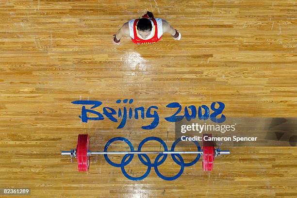 Cao Lei of China prepares to lift in the women's 75kg weightlifting event at the Beijing University of Aeronautics & Astronautics Gymnasium on Day 7...