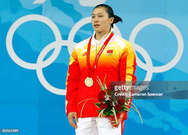 Gold medal winner Cao Lei of China stands on the podium during the medal ceremony for the women's 75kg weightlifting at the Beijing University of...