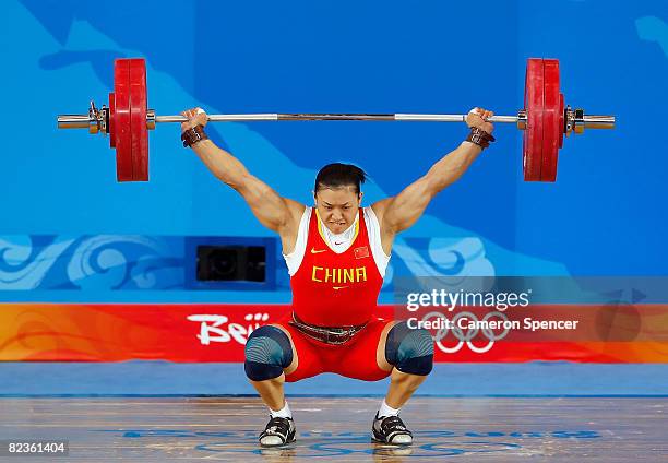 Cao Lei of China competes in the women's 75kg weightlifting event at the Beijing University of Aeronautics & Astronautics Gymnasium on Day 7 of the...