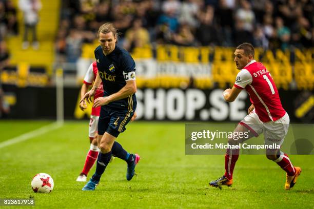 Nils-Eric Johansson of AIK in a duel with Nikola Stojiljkovic of SC Braga during a UEFA Europa League qualification match between AIK and SC Braga at...