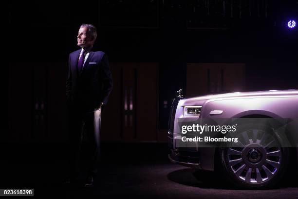 Torsten Mueller-Oetvoes, chief executive officer of Rolls-Royce Motor Cars Ltd., poses for a photograph during a media preview of the unveiling of...