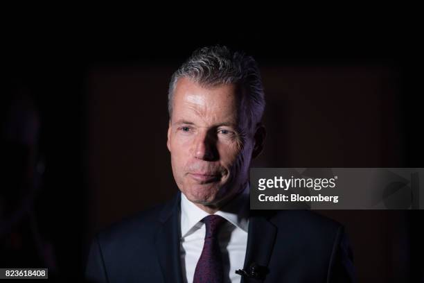 Torsten Mueller-Oetvoes, chief executive officer of Rolls-Royce Motor Cars Ltd., pauses while speaking during a media preview of the unveiling of the...