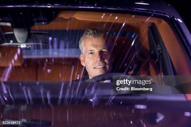 Torsten Mueller-Oetvoes, chief executive officer of Rolls-Royce Motor Cars Ltd., poses for a photograph during a media preview of the unveiling of...