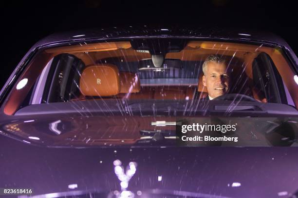 Torsten Mueller-Oetvoes, chief executive officer of Rolls-Royce Motor Cars Ltd., poses for a photograph during a media preview of the unveiling of...