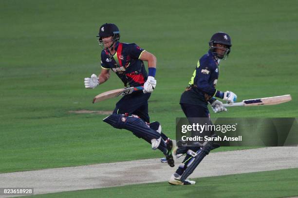 Joe Denly of Kent Spitfires runs a quick single with opening partner Daniel Bell-Drummond during the NatWest T20 Blast South Group match at The...