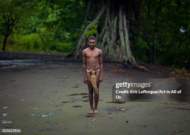 Teenager wearing a penis sheath called a namba standing in the middle of the ceremonial square, Tanna island, Yakel, Vanuatu on September 6, 2007 in...