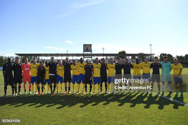 Juventus second team and Pro Vercelli line up during the joint training Juventus second team v Pro Vercelli on July 27, 2017 in Turin, Italy.