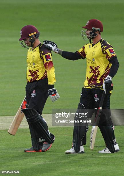 Peter Trego of Somerset puts a sympathetic hand on teammate Johann Myburgh's shoulder after Myburgh is dismissed for 64 runs from 35 balls during the...