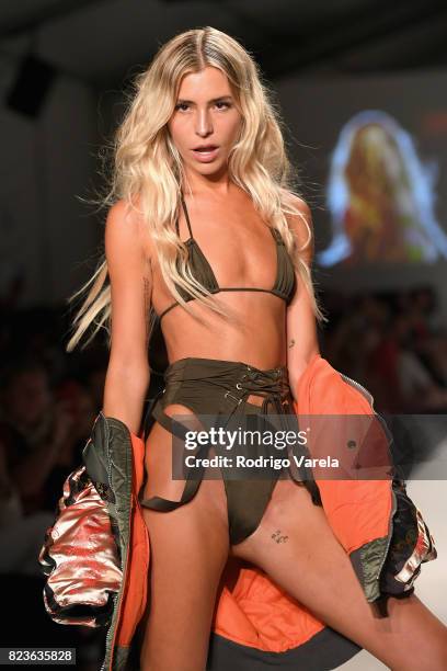 Model walks the runway at the SWIMMIAMI Hot-As-Hell 2018 Collection fashion show at 227 22nd Street on July 21, 2017 in Miami Beach, Florida.