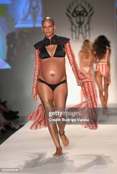 Model walks the runway at the SWIMMIAMI Hot-As-Hell 2018 Collection fashion show at 227 22nd Street on July 21, 2017 in Miami Beach, Florida.