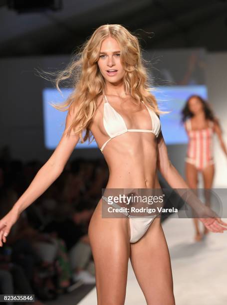 Model walks the runway at the SWIMMIAMI Hot-As-Hell 2018 Collection fashion show at 227 22nd Street on July 21, 2017 in Miami Beach, Florida.