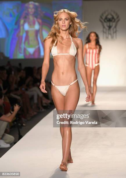 Model walks the runway at the SWIMMIAMI Hot-As-Hell 2018 Collection fashion show at 227 22nd Street on July 21, 2017 in Miami Beach, Florida.