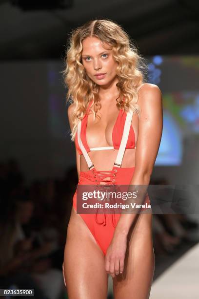 Model walks the runway at the SWIMMIAMI Hot-As-Hell 2018 Collection fashion show at 227 22nd Street on July 21, 2017 in Miami Beach, Florida.