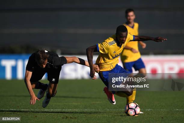 King Udoh of Juventus second team in action against Filippo Berra of Pro Vercelli during the joint training Juventus second team v Pro Vercelli on...