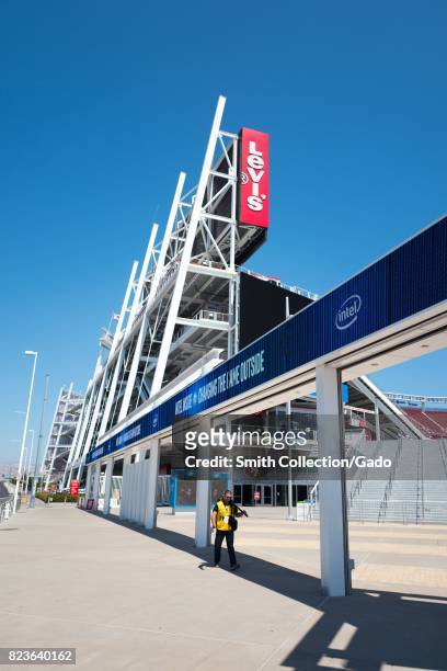 Photographer carries his camera at Levi's Stadium, home to the San Francisco 49ers football team, in the Silicon Valley town of Santa Clara,...