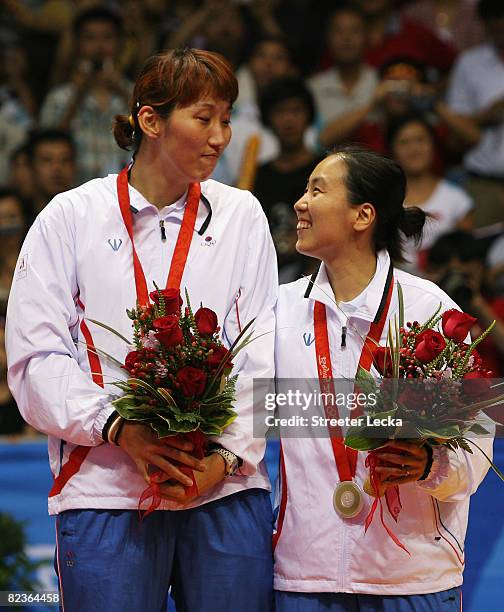 Silver medalists Lee Hyojung and Lee Kyungwon of South Korea pose with their medals after the Women's Doubles at the Beijing University of Technology...