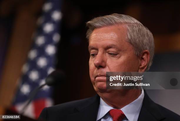 Sen. Lindsey Graham pauses during a news conference to announce opposition to the so-called skinny repeal of Obamacare at the U.S. Capitol July 27,...