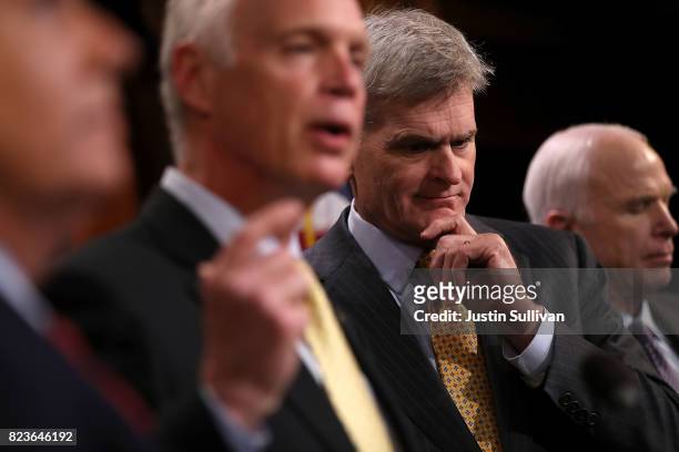 Sen. Bill Cassidy looks on at a news conference held to announce opposition to the so-called skinny repeal of Obamacare at the U.S. Capitol July 27,...