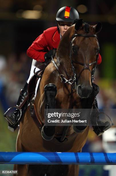 Meredith Micheals-Beerbaum of Germany and Shutterfly jump a fence during the Show Jumping First Round Qualifiers held at the Hong Kong Olympic...