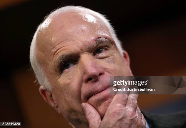 Sen. John McCain looks on during a news conference to announce opposition to the so-called skinny repeal of Obamacare at the U.S. Capitol July 27,...