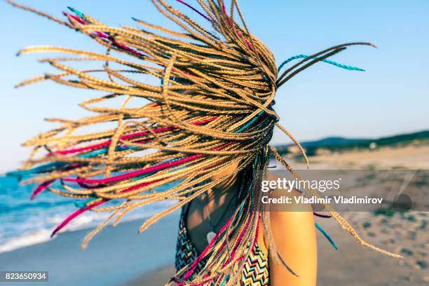 wind and multicolored braided hair - braided hair imagens e fotografias de stock