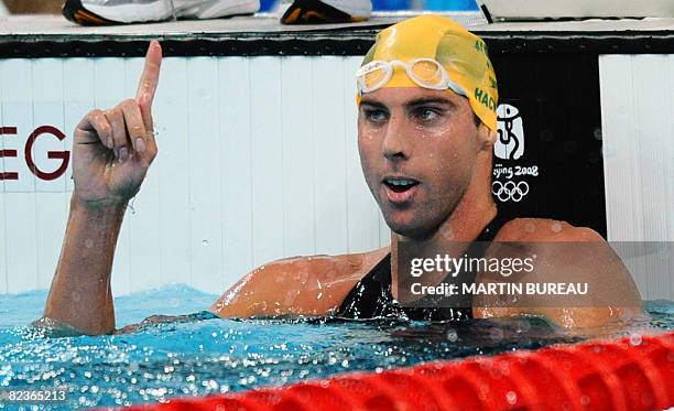 Australia's Grant Hackett finishes the men's 1500m freestyle swimming heats at the National Aquatics Center during the 2008 Beijing Olympic Games in...