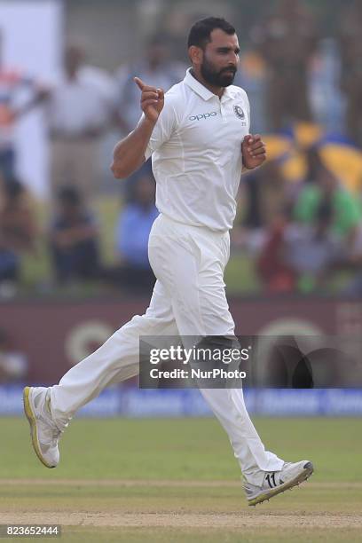 Indian cricketer Mohammed Shami celebrates during the 2nd Day's play in the 1st Test match between Sri Lanka and India at the Galle International...