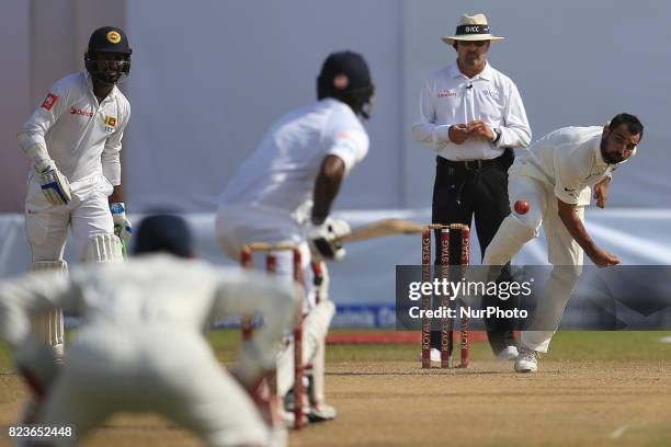 Indian cricketer Mohammed Shami delivers a ball during the 2nd Day's play in the 1st Test match between Sri Lanka and India at the Galle...