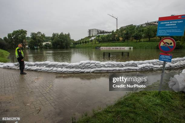 People watching at the emergency reservoir in Zabornia district are seen in Gdansk, Poland on 27 July 2017 Due the strong raining for more than two...