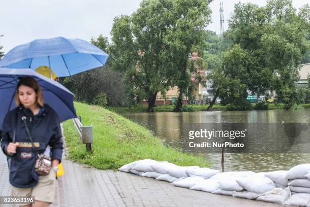 People watching at the emergency reservoir in Zabornia district are seen in Gdansk, Poland on 27 July 2017 Due the strong raining for more than two...