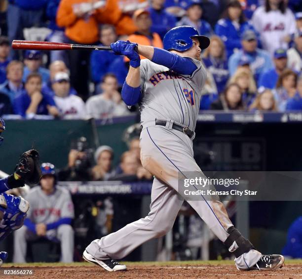 The New York Mets' Lucas Duda hits an RBI single against the Kansas City Royals during Game 2 of the World Series on October 28 at Kauffman Stadium...