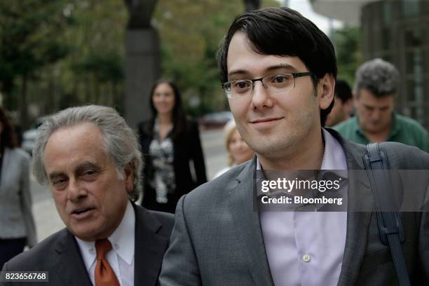 Martin Shkreli, former chief executive officer of Turing Pharmaceuticals AG, right, exits federal court with his attorney Benjamin Brafman in the...