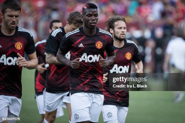 Paul Pogba of Manchester United leads the team into the locker room to start the International Champions Cup match between FC Barcelona and...