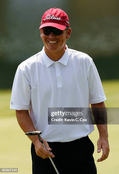 Garrett Willis smiles after a birdie putt on the 15th green during the second round of the 2008 Wyndham Championship at Sedgefield Country Club on...