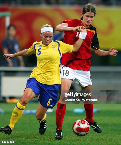 Sara Thunebro of Sweden and Kerstin Garefrekes of Germany compete for the ball during the Women's Quarter Final match between Sweden and Germany at...