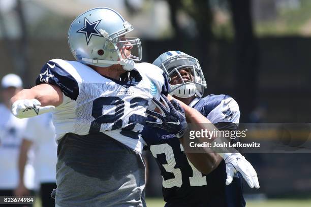 Jason Witten of the Dallas Cowboys runs through a drill while being guarded by Byron Jones during morning practice on July 27, 2017 in Oxnard,...