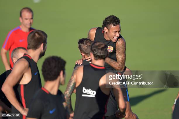 Barcelona player Neymar takes part in a training session at Barry University in Miami, Florida, on July 27 two days before their International...