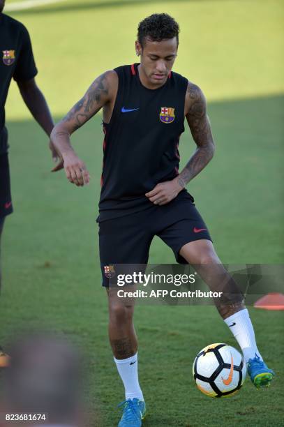 Barcelona player Neymar takes part in a training session at Barry University in Miami, Florida, on July 27 two days before their International...