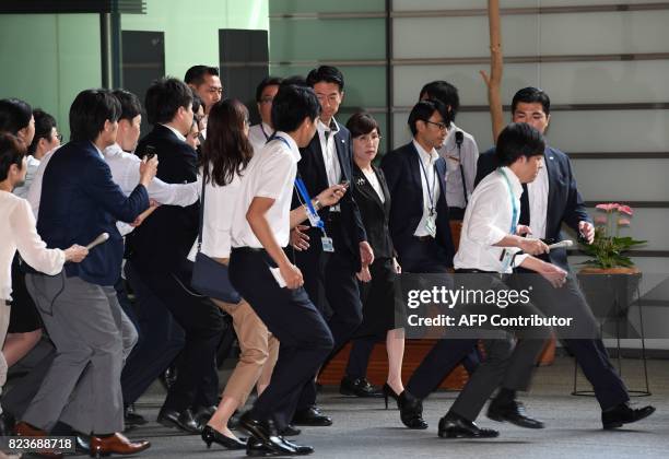 Japan's Defence Minister Tomomi Inada arrives to attend the cabinet meeting at prime minister's official residence in Tokyo on July 28, 2017. Inada...